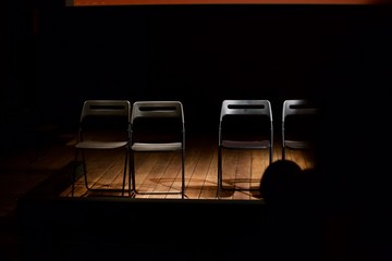 chairs on an empty stage