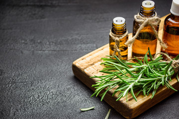 Rosemary essential oil on black background