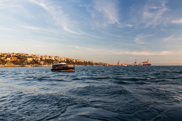 Obraz premium Boat in the Bosphorus on the background of the city of Istanbul. Turkey