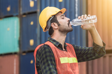 Worker is drinking water after finishing work