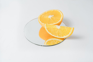 Sliced orange fruit segments isolated on white