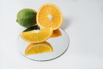 Sliced orange fruit segments isolated on white