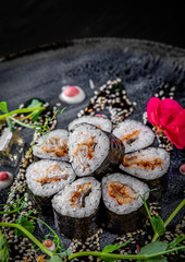 sushi roll with eel and rice in plate