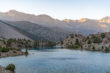 The beautiful mountain trekking road with clear blue sky and rocky hills and the view of Alaudin...