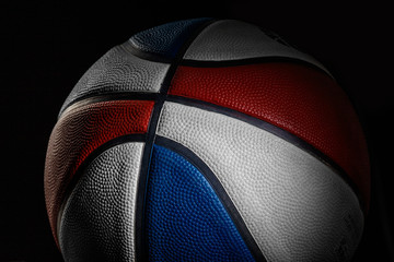 Basketball ball. Professional sport equipment isolated on black studio background. Concept of sport, leadership, competition, healthy lifestyle in motion and action, training. Close up, copyspace.