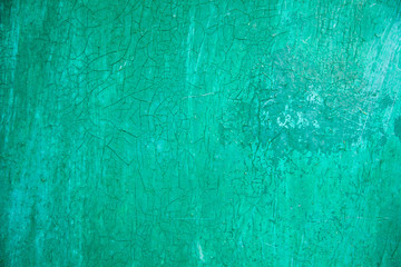 cracked green background. grunge texture, decorative emerald wooden background. free space, place for text