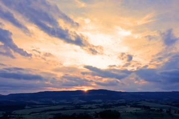 Fototapeta premium Aerial view of sunset landscape in the forest. Rural life scene. Great landscape.