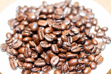 Cup of coffee with coffee beans on old background