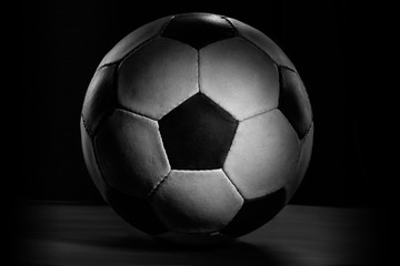 Fototapeta na wymiar Soccer ball. Professional sport equipment isolated on black studio background. Concept of sport, leadership, competition, healthy lifestyle in motion and action, training. Close up, copyspace.