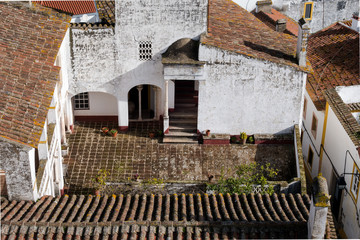 View over rooftops and courtyards in historic Evora in Portugal