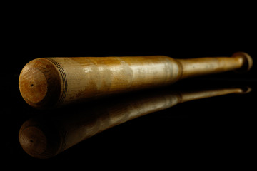 Baseball bat. Professional sport equipment isolated on black studio background. Concept of sport, leadership, competition, healthy lifestyle in motion and action, training. Close up, copyspace.
