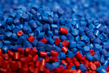 Blue and red Plastic polymer granules  - obrazy, fototapety, plakaty