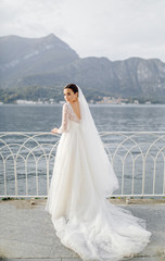 Fototapeta na wymiar Happy wedding couple in Como Lake, Italy