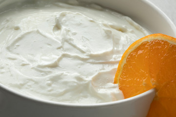 Bowl with homemade strained yoghurt close up