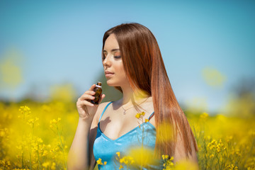 Woman smelling essential oil