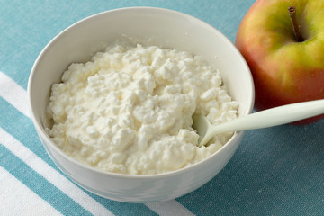 Bowl with cottage cheese close up