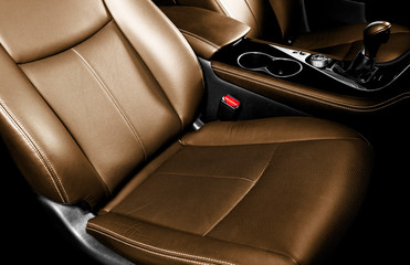 Luxury car brown leather interior. Part of leather car seat details with stitching. Comfortable...