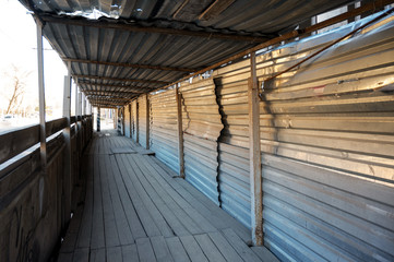pedestrian sidewalk is protected with a metal frame from construction work. Safety on city streets. repair of old city buildings