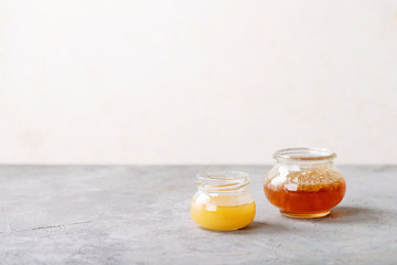 Glass cup of black tea served with honey