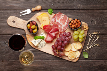 Cheese, meat, grapes and olives antipasto