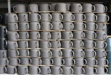 Coffee cups retro design stacking on shelves  at local shop no brand no pattern for sale