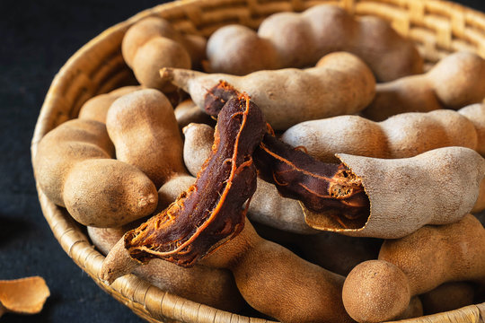 Tamarind in a wooden basket on the table