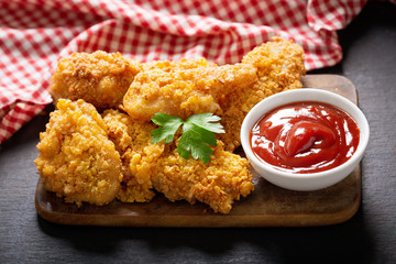 fried chicken on a wooden board