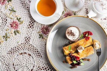 Crepes with butter, jam and sour cream