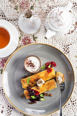 Crepes with butter, jam and sour cream
