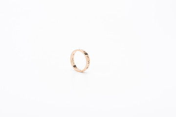 The gold proposal diamond ring stands alone against a white background.