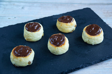 Cheesecakes with bitter chocolate and different berries