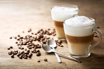 glasses of latte macchiato coffee - obrazy, fototapety, plakaty