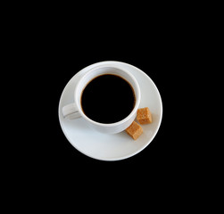 A Cup of coffee with two sugar cubes on a black background