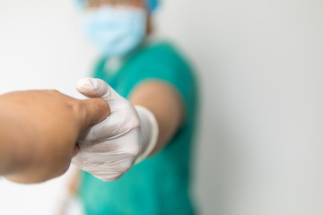 Friendly male medicine doctor hands holding patient hand for encouragement, empathy, cheering and...