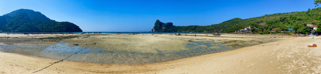 PHI PHI DON, THAILAND - DECEMBER 2019: Loh Dalum Beach in Phi Phi Don on a sunny afternoon. Panoramic view