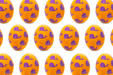 Colorful painted Easter egg whales in isolated background