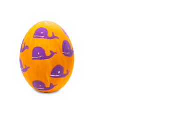 Colorful painted Easter egg whales in isolated background