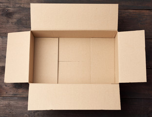 open  brown square cardboard box for transporting goods