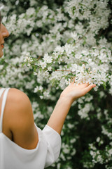 Girl on the background of a flower Apple tree