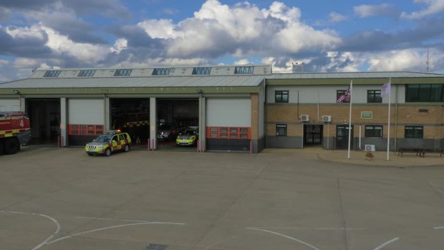Airport fire department vehicle reverses into garage