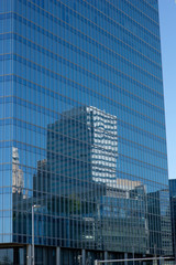reflections of skyline in a skyscraper