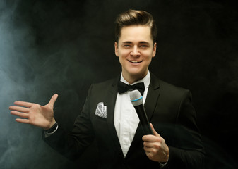 Young handsome man with microphone