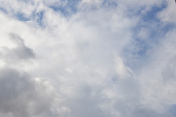 White clouds in blue sky without sun
