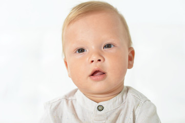 Portrait of beautiful cute baby boy in studio