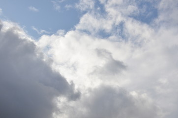 White clouds in blue sky without sun