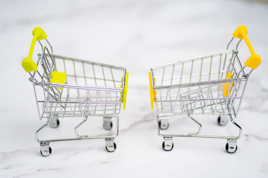 Shopping trolleys on light background