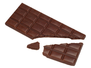 close up of dark porous chocolate pieces on white background