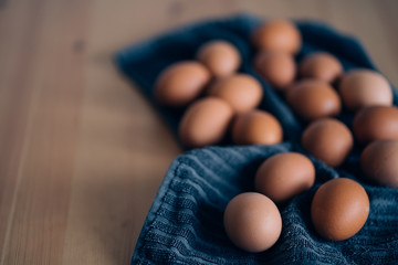 Raw chicken eggs on table