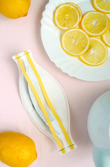 Concept flat lay about healthcare and coronavirus protection. Medical mask, Green tea, yellow lemons with vitamin C help people to save immunity and prevent pandemic.