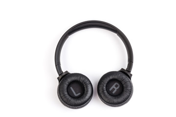 Black wireless headphones on white background.  Advanced acoustic stereo sound system